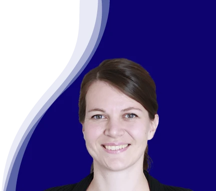 Jasmin Nesbigall from oneworld looks into the camera with a smile. She has brown hair with a side parting, tied back at the nape of her neck. She is wearing a black top. The background is dark blue with a curved, white and light blue line in a wave shape on the left.